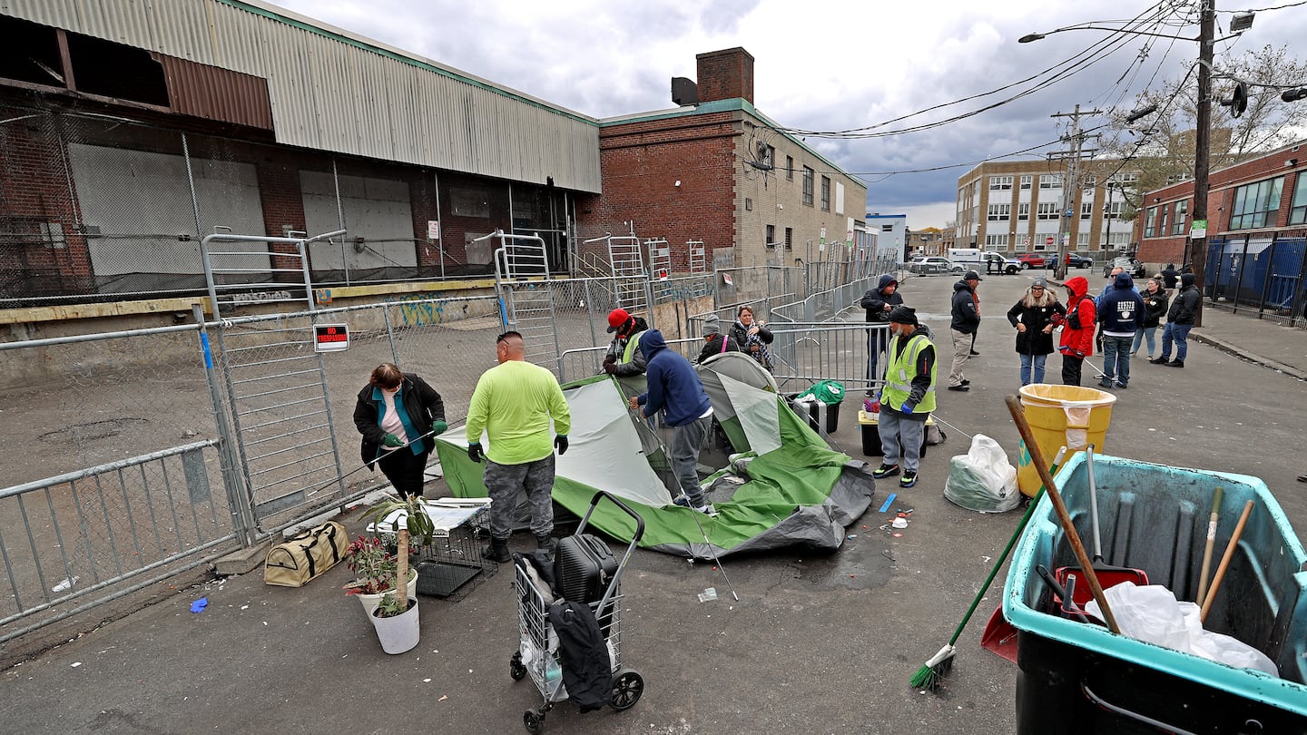 City of Boston workers disposed of tents and other items at the intersection of Melnea Cass Boulevard and Massachusetts Avenue in November 2023, as part of the city's response to the overlapping crises of substance use disorder, mental health, and homelessness.