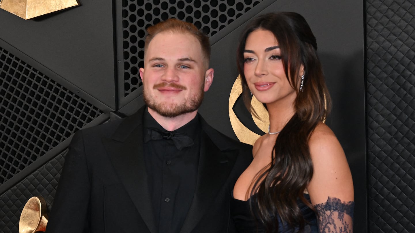 US country musician Zach Bryan and girlfriend Brianna Chickenfry arrives for the 66th Annual Grammy Awards at the Crypto.com Arena in Los Angeles on February 4, 2024.