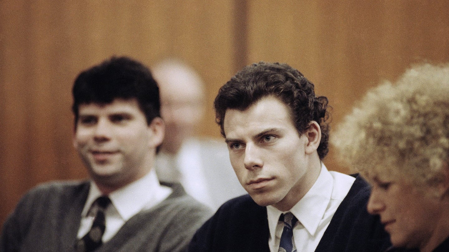 Lyle, left, and Erik Menendez sit with defense attorney Leslie Abramson, right, in Beverly Hills Municipal Court during a hearing, Nov. 26, 1990.