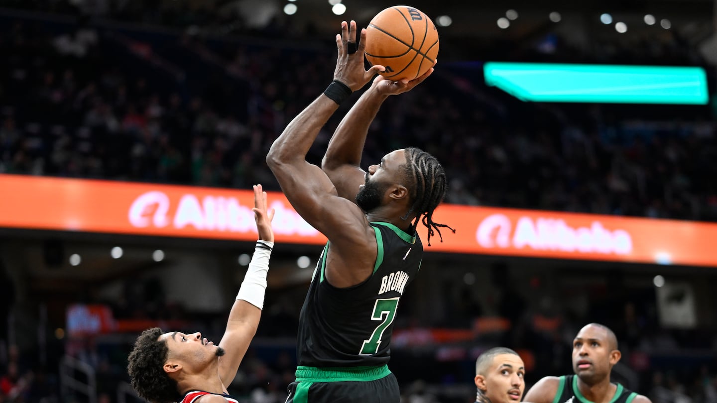 Jaylen Brown scores over Wizards guard Jordan Poole in the second half.