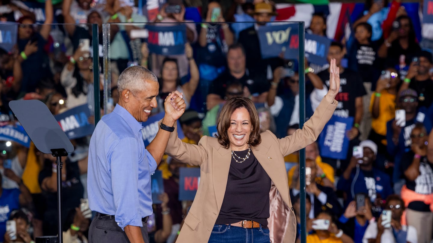 Vice President Kamala Harris on stage with former president Barack Obama during a campaign rally in Atlanta on Oct. 24.