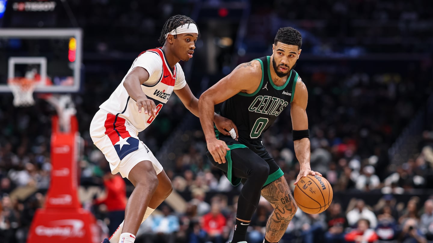 Jayson Tatum brings the ball up court against Wizards rookie Bub Carrington during the second half of the Celtics' 122-102 victory Thursday at Capital One Arena in Washington.