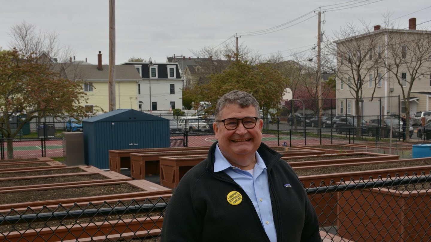 Triumvirate owner John McQuillan is spending $10 million to launch an institute that focuses on the interplay of science and society. He is pictured here at Glen Park in Somerville, where recycled plastic lumber made by Triumvirate was used to construct 18 raised garden beds for a community initiative.