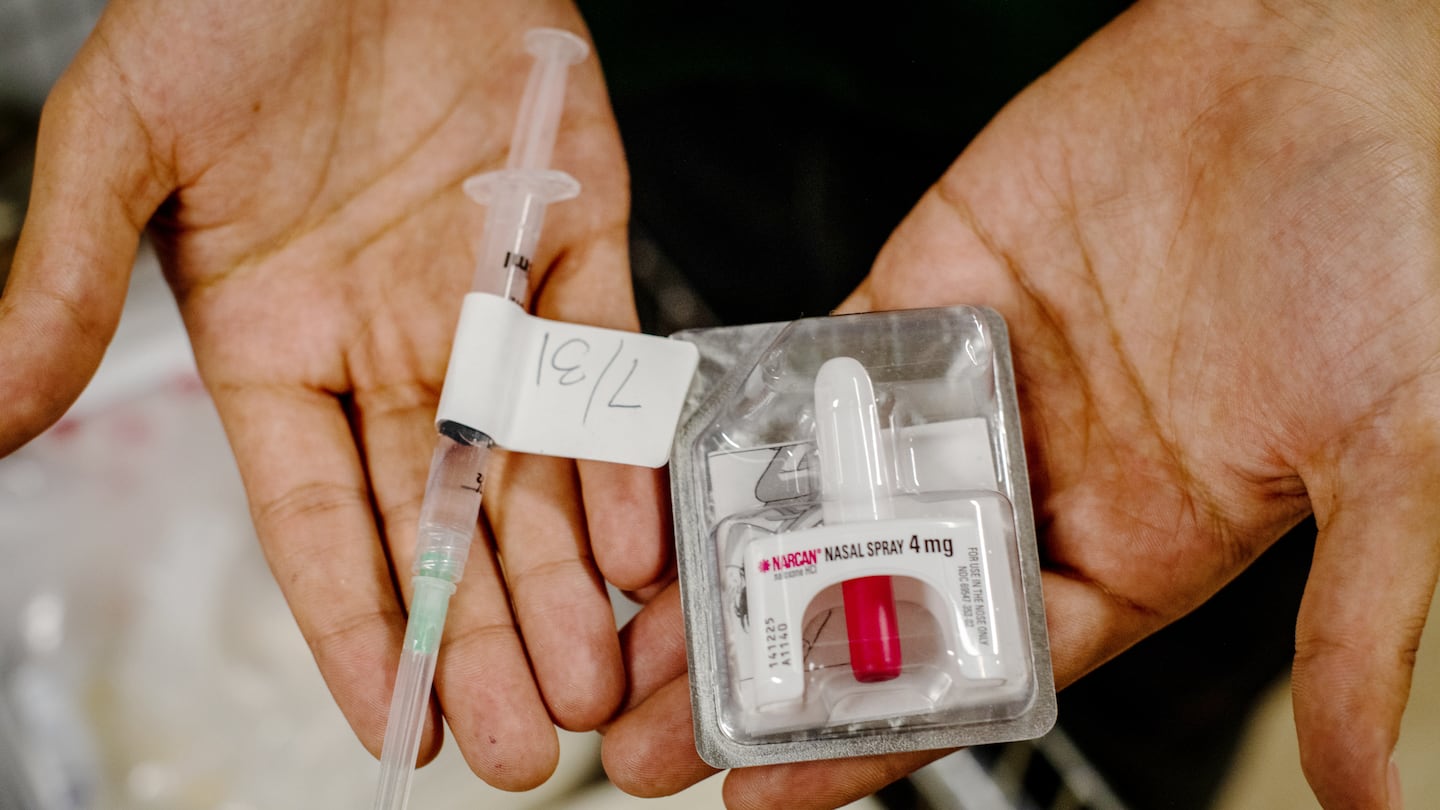 An outreach worker showed nasal Narcan, also known as naloxone, in New York. Federal officials have celebrated a striking drop in drug overdoses across the country, but state-level data shows that Black people are suffering significantly worse outcomes than white people.