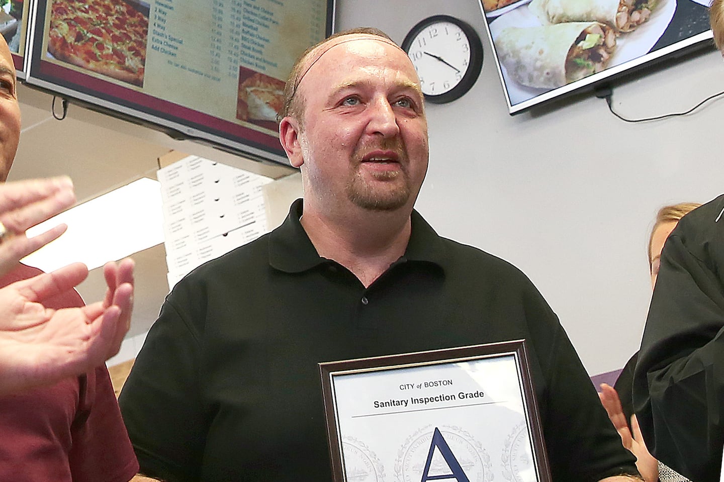 Stash's Pizza owner Steve Papantoniadis held an "A" certificate after a final inspection by the Health Division of the Inspectional Services Department on Nov. 2, 2016.