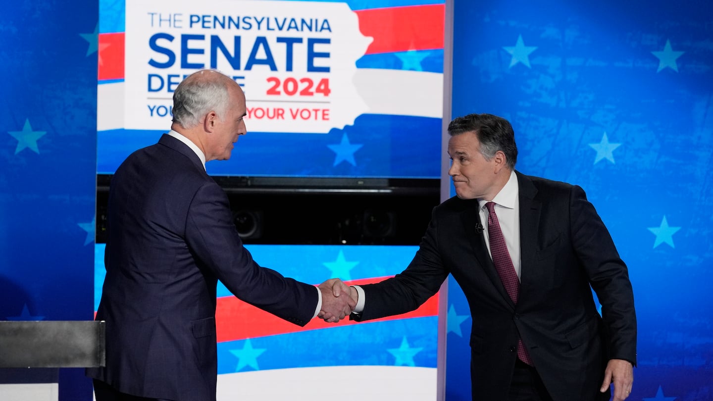 Democratic US Senator Bob Casey, left, shakes hands with his Republican opponent, former hedge fund chief executive Dave McCormick, before their second debate in Philadelphia on Oct. 15.