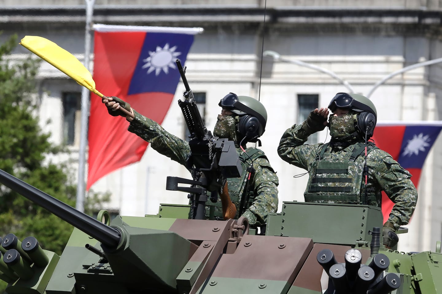 Taiwanese soldiers salute during National Day celebrations in front of the Presidential Building in Taipei, Taiwan, on Oct. 10, 2021.