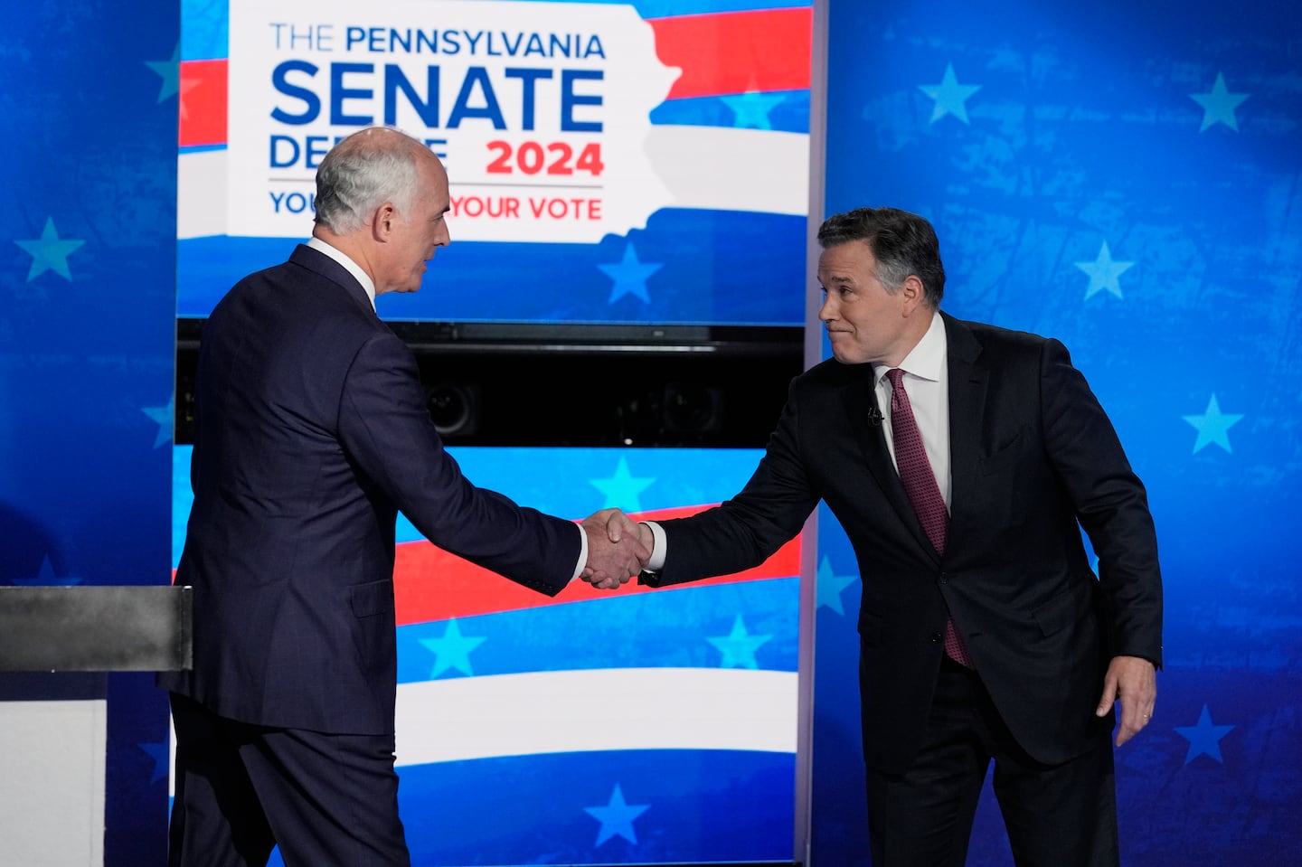 Democratic US Senator Bob Casey, left, shakes hands with his Republican opponent, former hedge fund chief executive Dave McCormick, before their second debate in Philadelphia on Oct. 15.