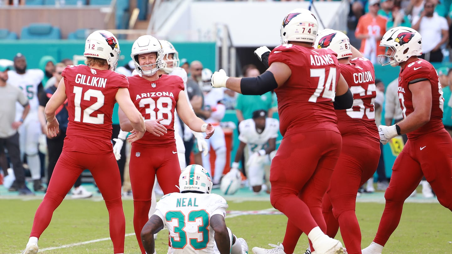 Holder Blake Gillikin and kicker Chad Ryland celebrate with their Cardinals' teammates after Ryland's game-winning field goal on Sunday in Miami Gardens, Fla.