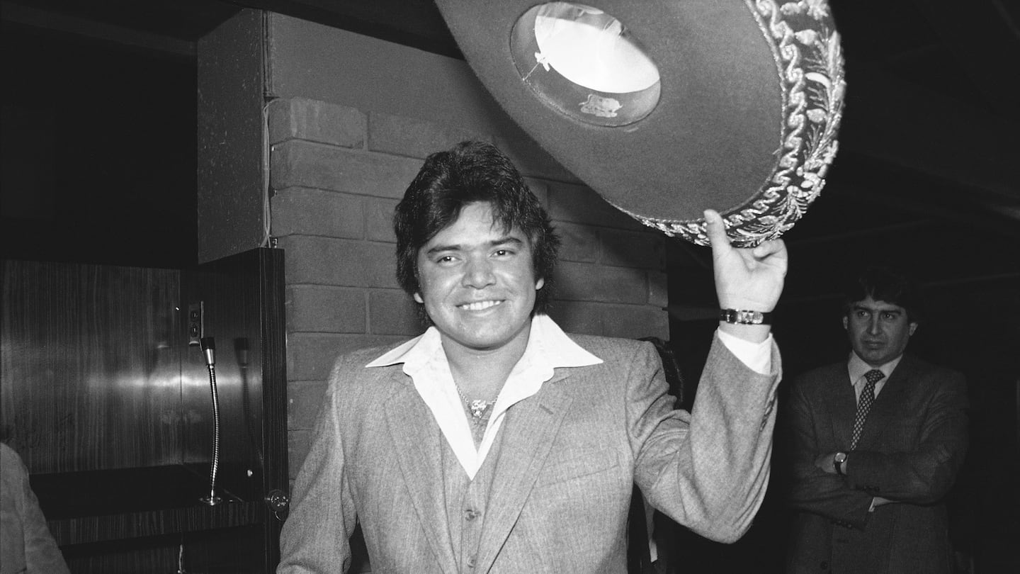 Los Angeles Dodger pitcher Fernando Valenzuela tips his sombrero at a news conference after he was named National League Rookie of the Year, Dec. 2, 1981, in Los Angeles.