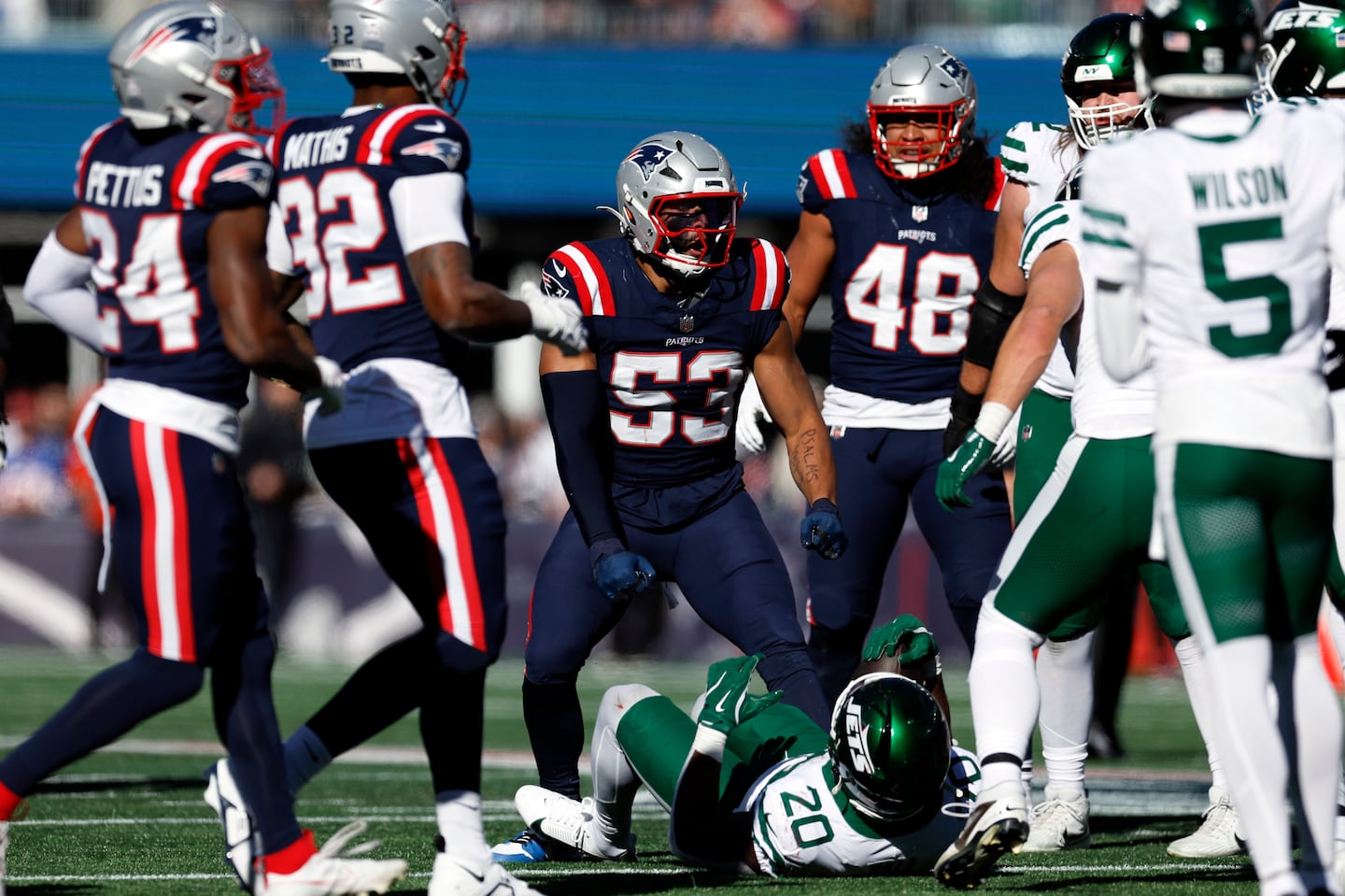 Linebacker Christian Elliss (center) led the Patriots with nine tackles Sunday, including a second-quarter stuff of Jets running back Breece Hall.