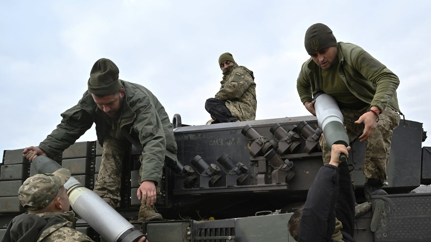 Tank crew members of the Ukrainian Ground Forces loaded projectiles onto a Leopard 2A4 tank during field training at an undisclosed location in Ukraine on Sunday.