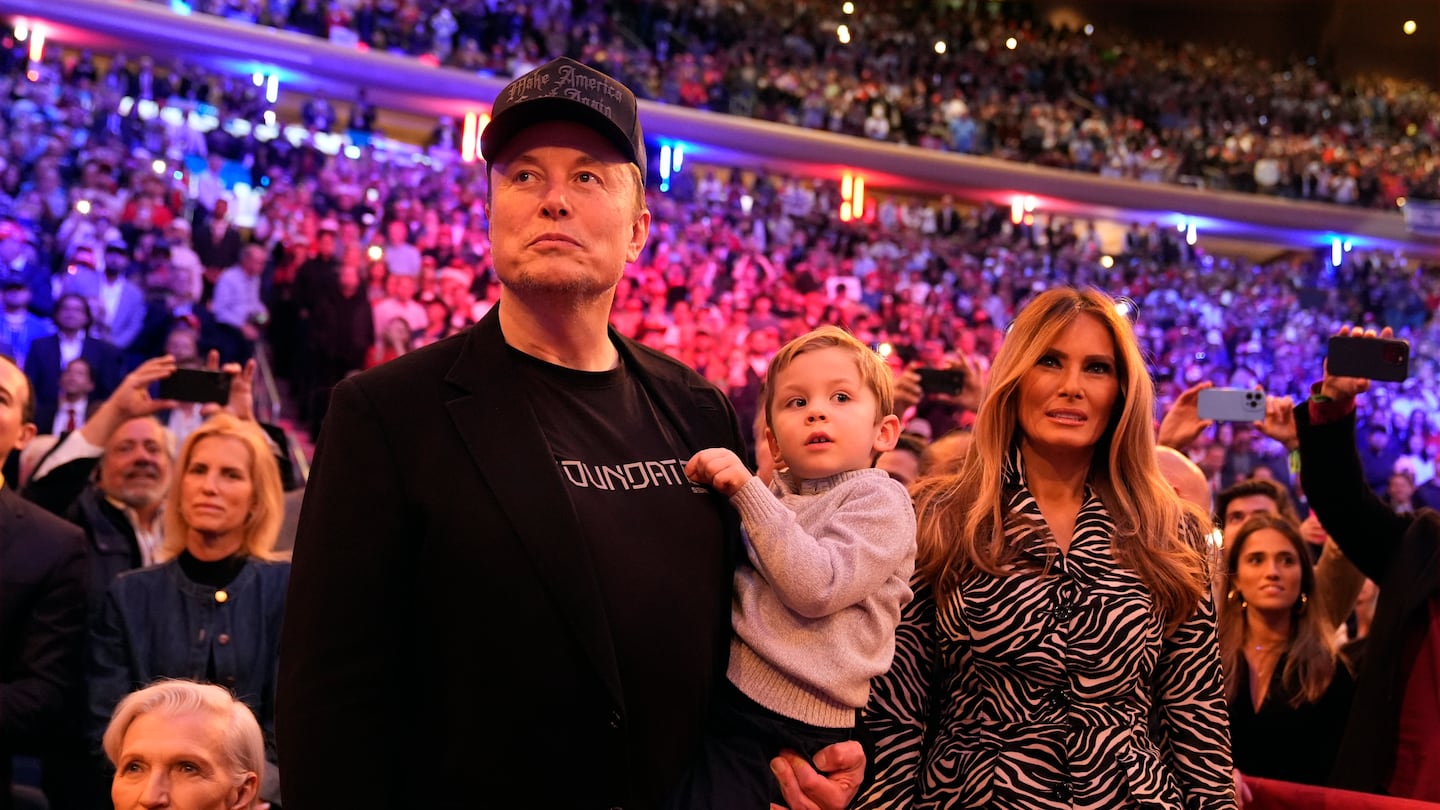 Elon Musk and former first lady Melania Trump listen as Republican presidential nominee former president Donald Trump speaks at a campaign rally at Madison Square Garden, Sunday, Oct. 27, 2024, in New York.