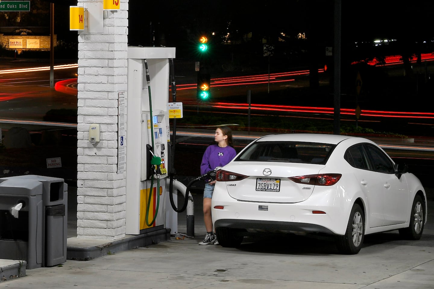 A customer pumps gas at a Shell gas station Monday, June 10, 2024, in Thousand Oaks, Calif.