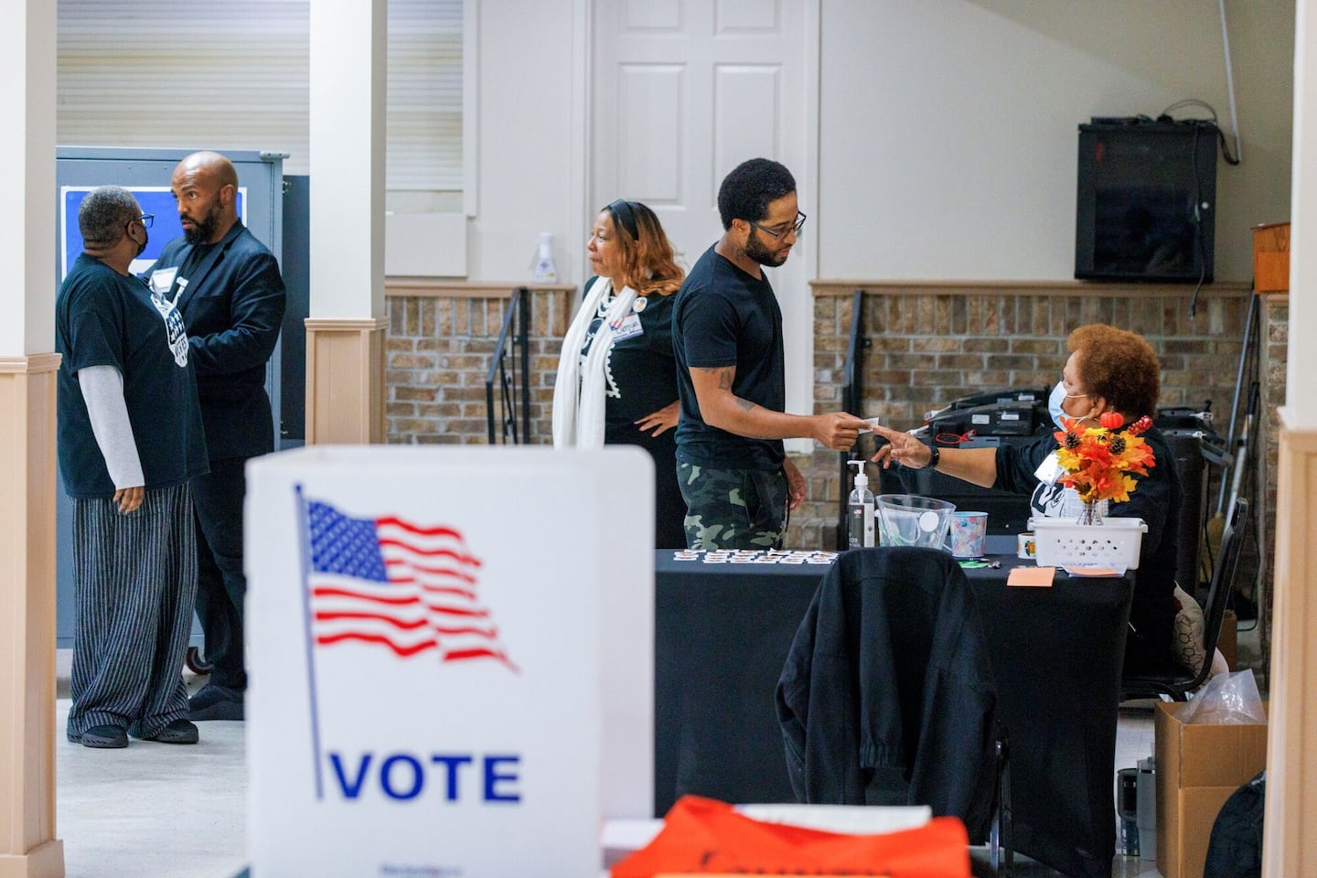 A voter cast their ballot at a polling location inside Metropolitan Branch Library during early voting in Atlanta.