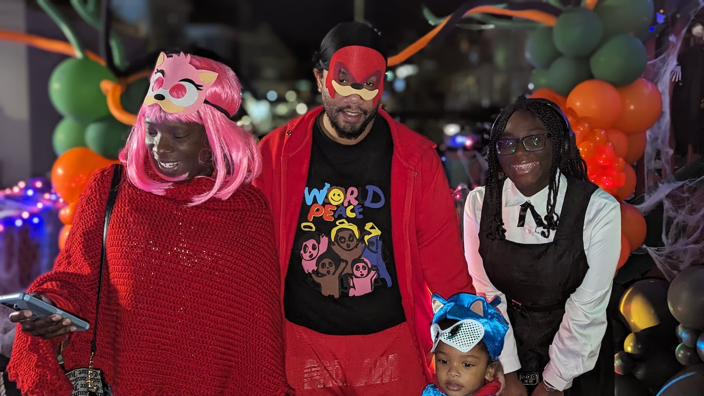 A family poses for a photo at last year's Nightmare on Nixon St. event.