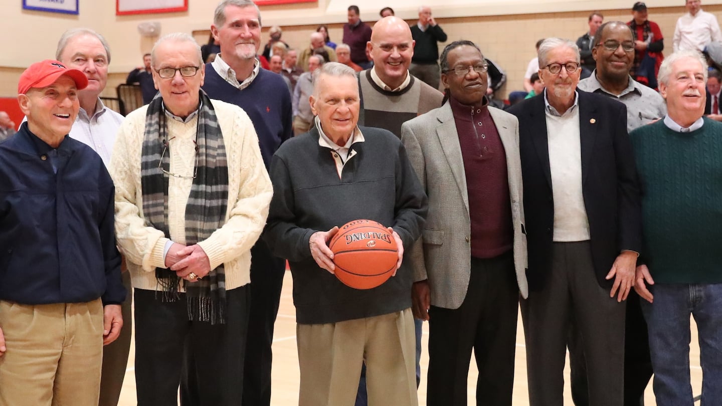 Ron Perry Sr. (center) is shown in 2019 at Catholic Memorial at an anniversary celebration for his 1969 team that went 29-0.