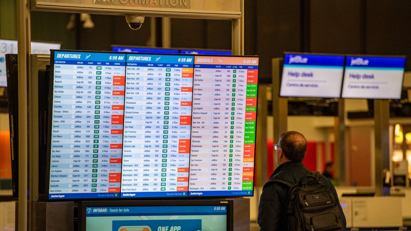 A traveler looked at the canceled flights at Logan Airport in January during a winter storm. 