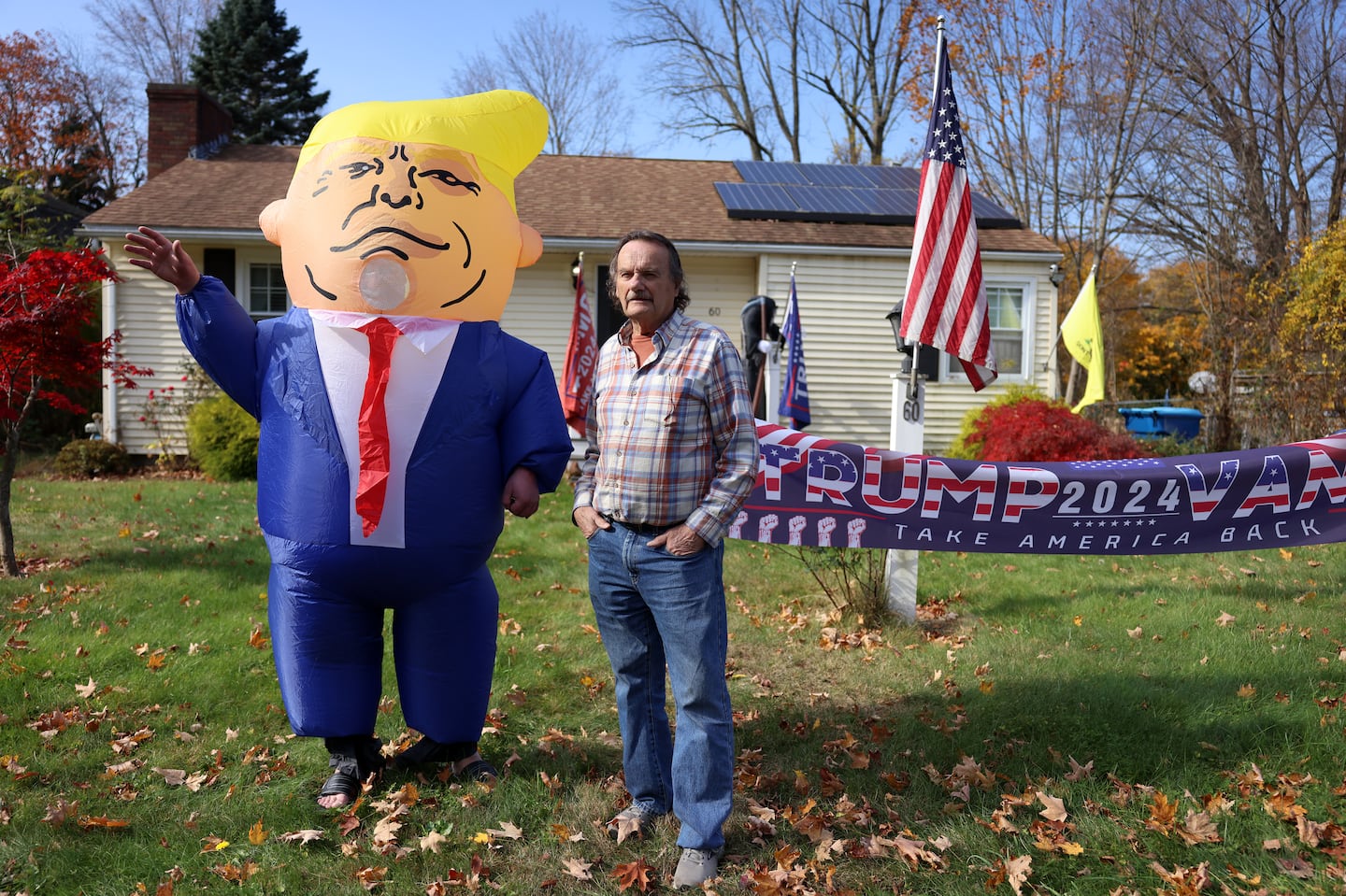 Arthur Paquette, a Trump voter from Leicester and part-owner of a local car dealership, stood with a friend  dressed in a Donald Trump costume.