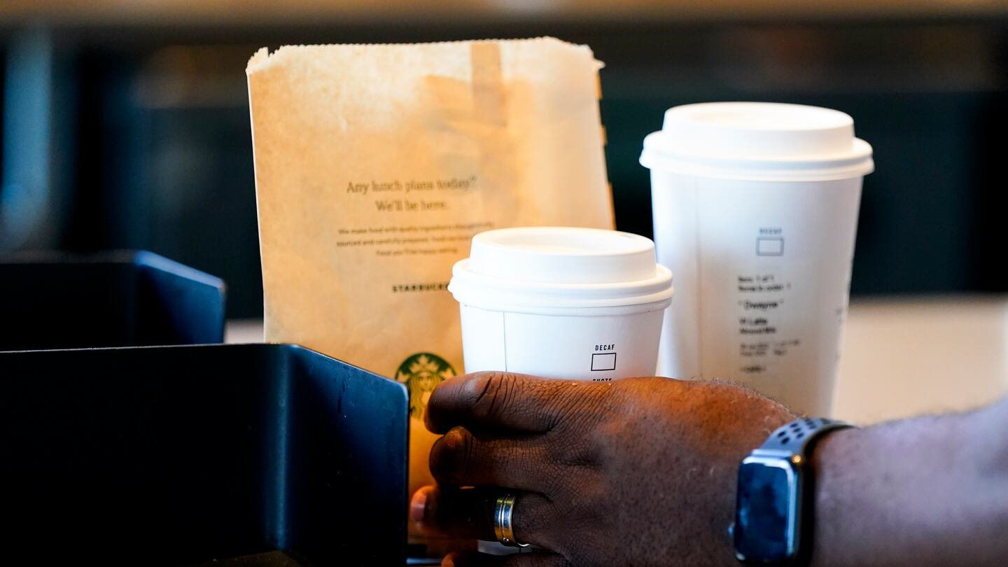 A customer picks up a drink at a Starbucks on June 28, 2023, in Seattle.