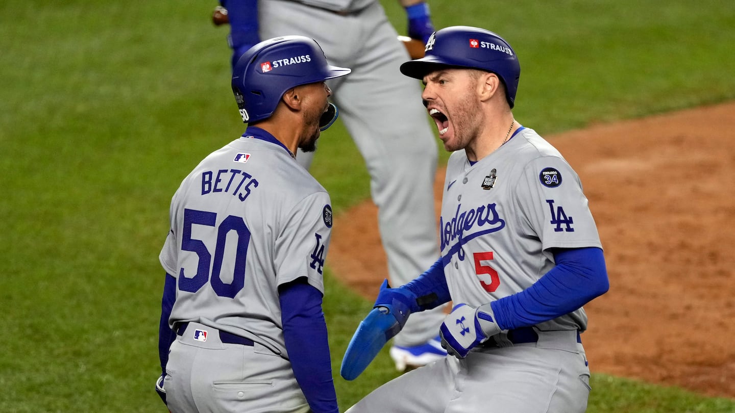 Mookie Betts knocked in the World Series-winning run with a bases-loaded sacrifice fly in the eighth inning Wednesday. He, Freddie Freeman (right), and Teoscar Hernández each knocked in two runs.