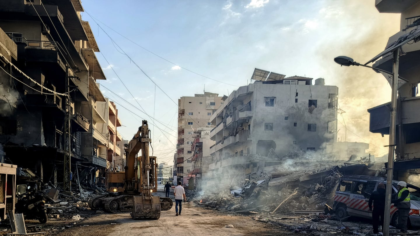 Civil defense workers remove the rubble from overnight's Israeli airstrikes that targeted the southern Lebanese village of Abbassiyeh on Oct. 31, 2024, amid the ongoing war between Israel and Hezbollah.