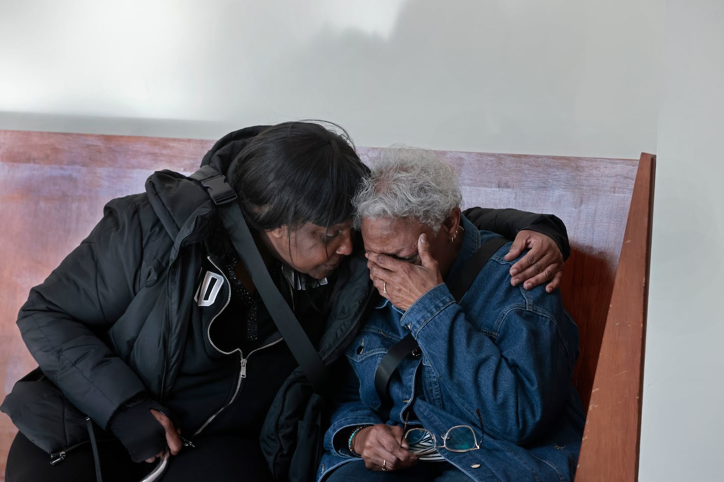 Annie Gordon, right, didn’t react to the jury’s verdict until she left the courtroom.  She is comforted by her best friend and neighbor Betty Lewis.