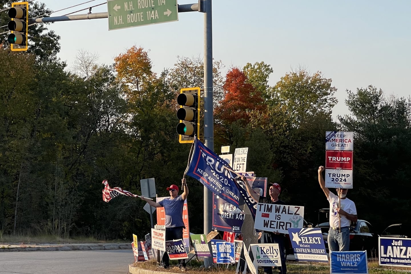 Frank Hobbs, 56; John Cairn, 64; and Val Touba, 69, waved flags and held signs recently alongside a busy intersection on New Hampshire Route 114. 