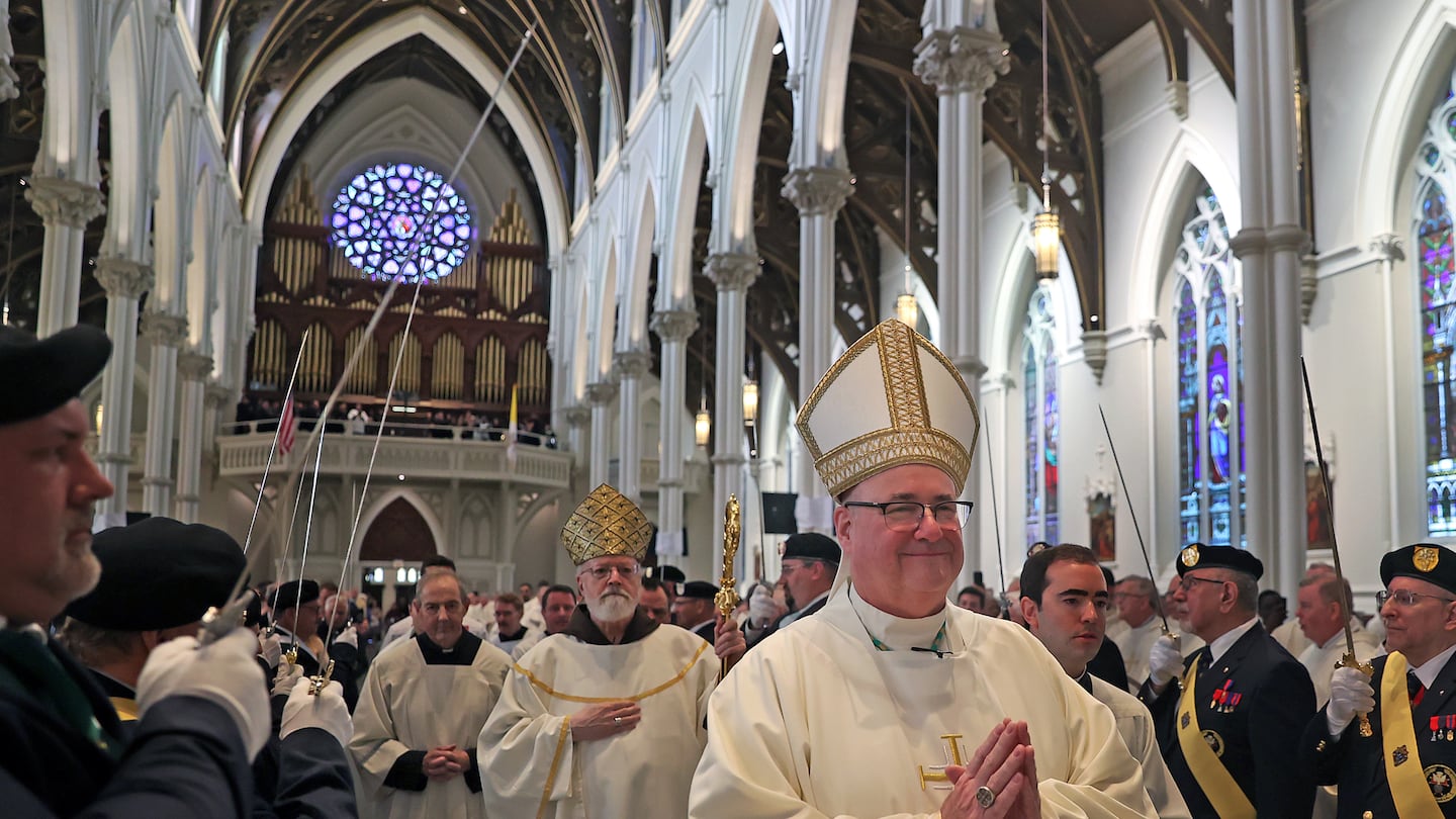 Incoming Archbishop Richard G. Henning was followed by Cardinal Seán P. O'Malley entering the Cathedral of the Holy Cross in Boston.