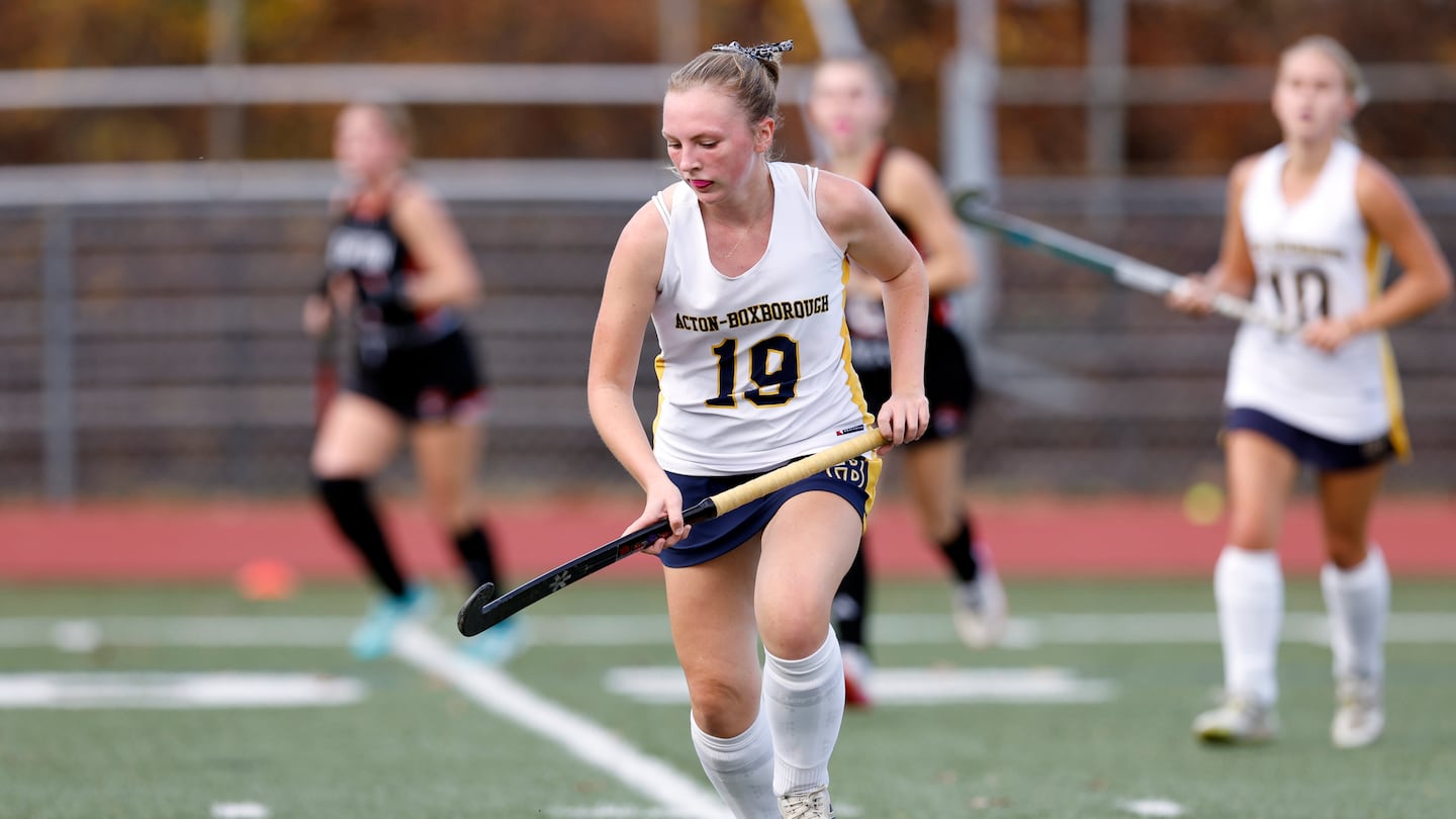 Acton-Boxborough’s Ryanne Tomlin (19) advances the ball against Newton North during Thursday's Division 1 first-round field hockey match.