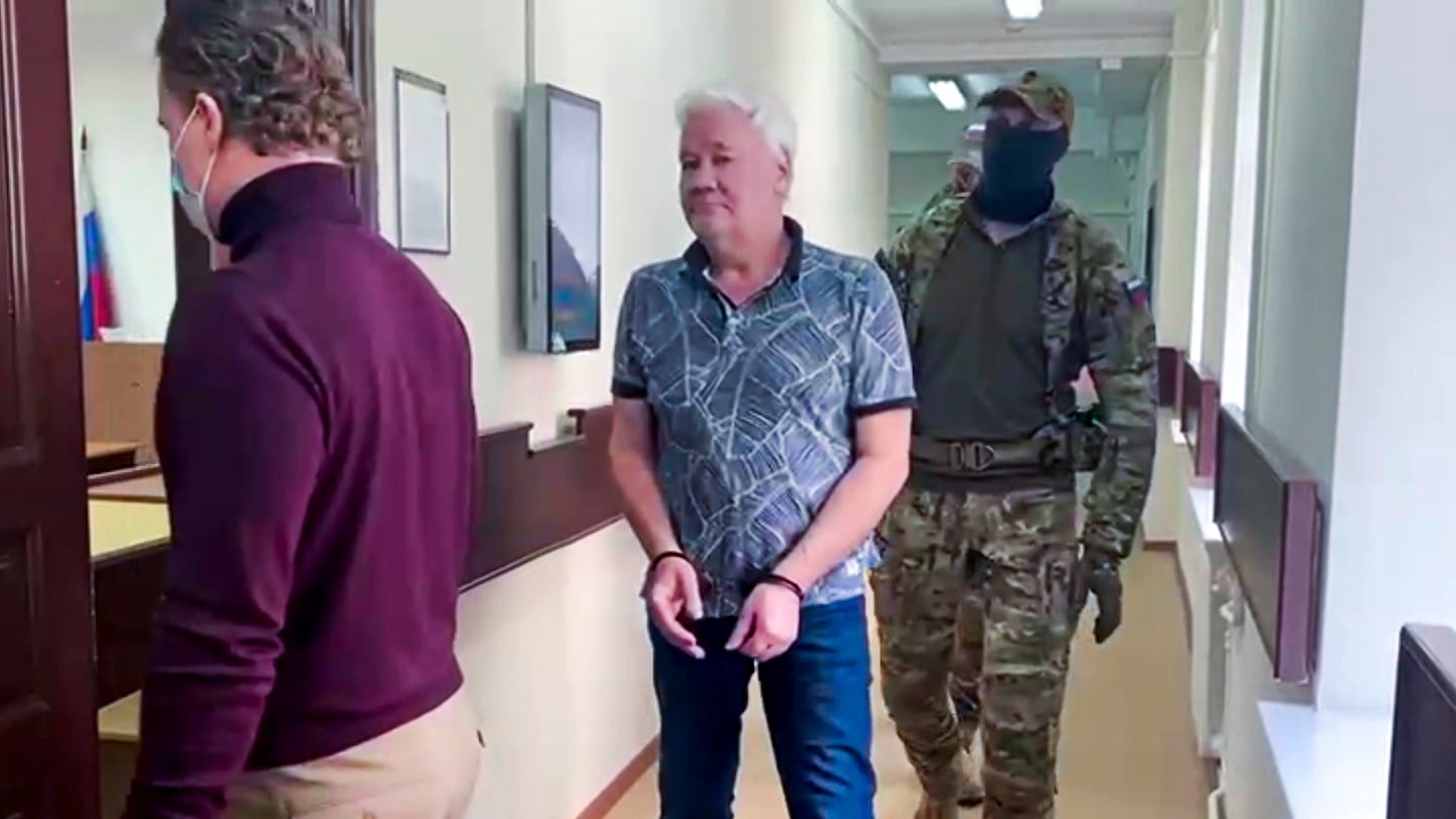 Robert Shonov, a Russian national who worked at the now-closed US consulate in Vladivostok for more than 25 years, is escorted by officers to the court room at the Lefortovo District Court in Moscow, Russia, on May 18, 2023.