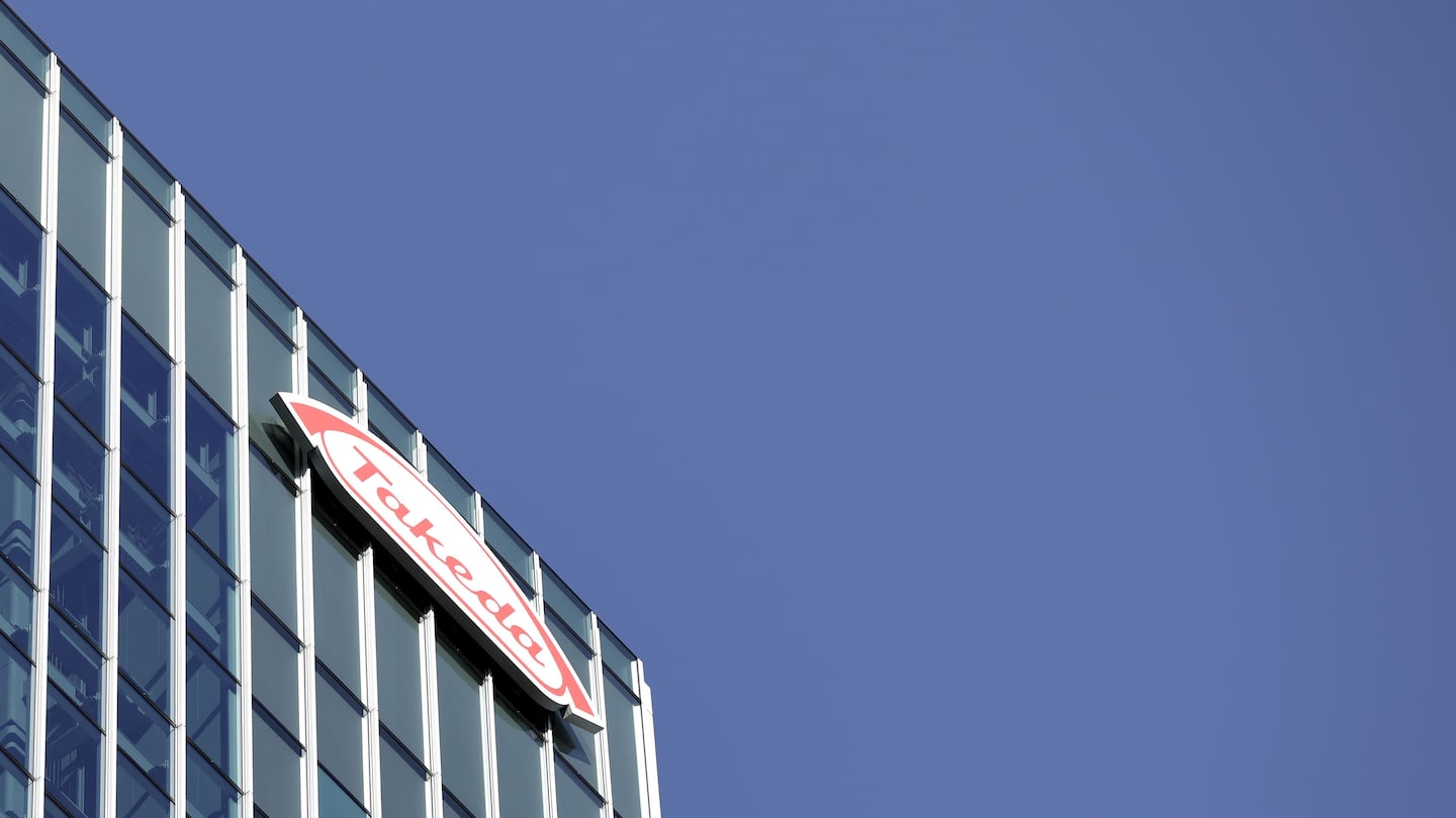 The Takeda Pharmaceutical Co. logo is displayed atop the company's global headquarters in Tokyo.