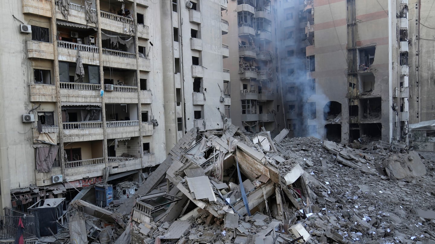 Smoke rises from a destroyed building that was hit today by an Israeli airstrike on Dahiyeh, in the southern suburb of Beirut, Lebanon.