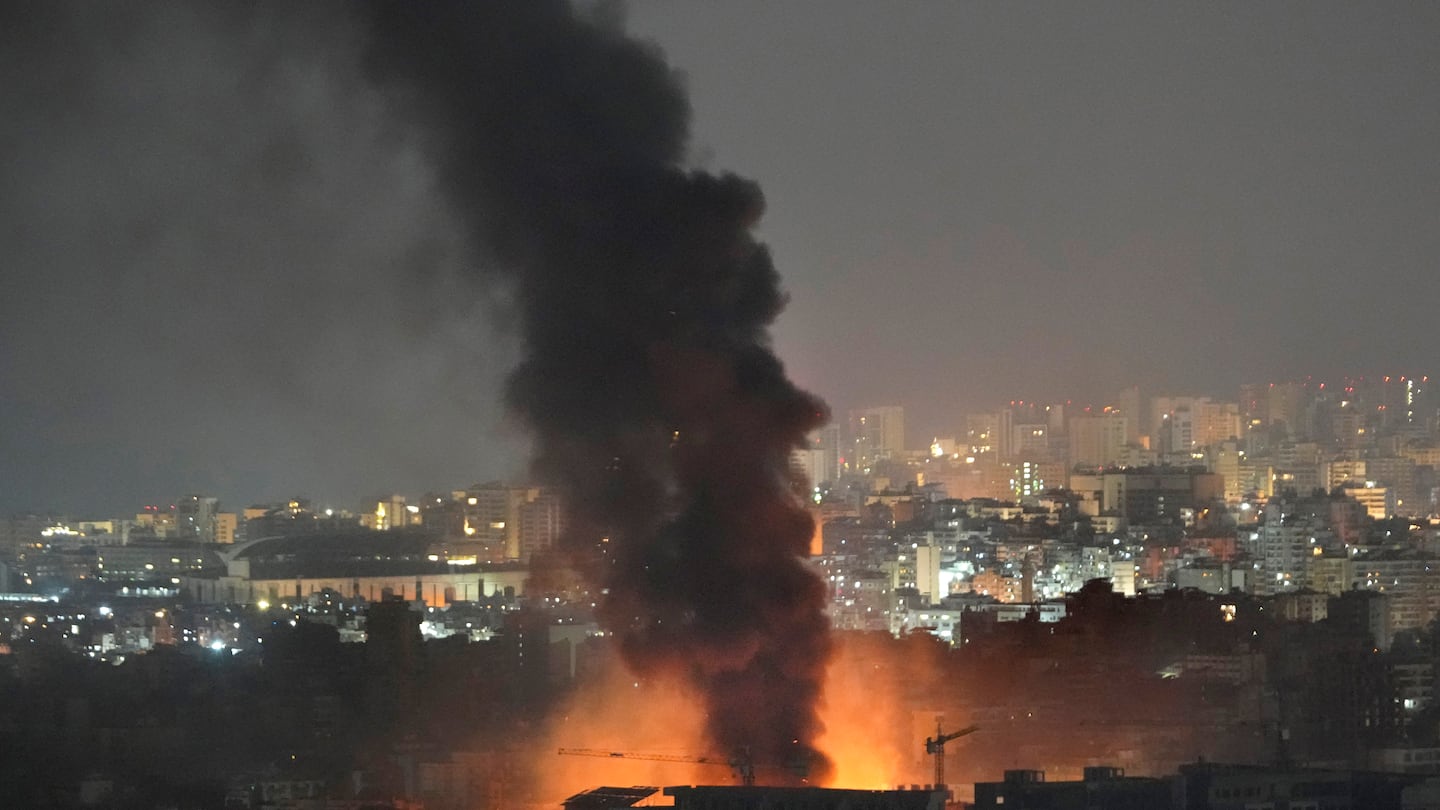 Flame and smoke rise from Israeli airstrikes on Dahiyeh, in the southern suburb of Beirut, Lebanon, early Friday.