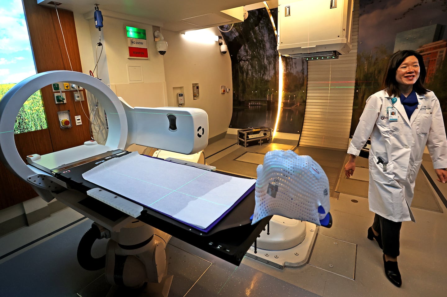 Dr. Helen Shih, medical director of Massachusetts General Hospital's Proton Therapy Centers, showed the proton therapy treatment room, which houses the only such equipment in New England. Mass General Brigham held a media tour of its cancer treatment facilities Monday as the system touted its own integrated cancer institute ahead of the 2028 departure of Dana-Farber from Brigham and Women's Hospital.