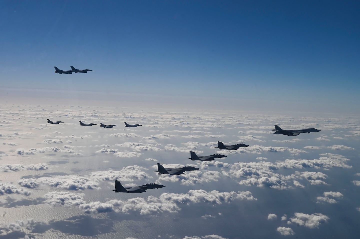 In this photo provided by the U.S. Air Force via South Korea Defense Ministry, U.S. Air Force B-1B bombers, F-16 fighter jets, South Korean Air Force F-15K fighter jets and Japanese Air Force F-2 fighter jets fly during a trilateral air drill at an undisclosed location, on Nov. 3.