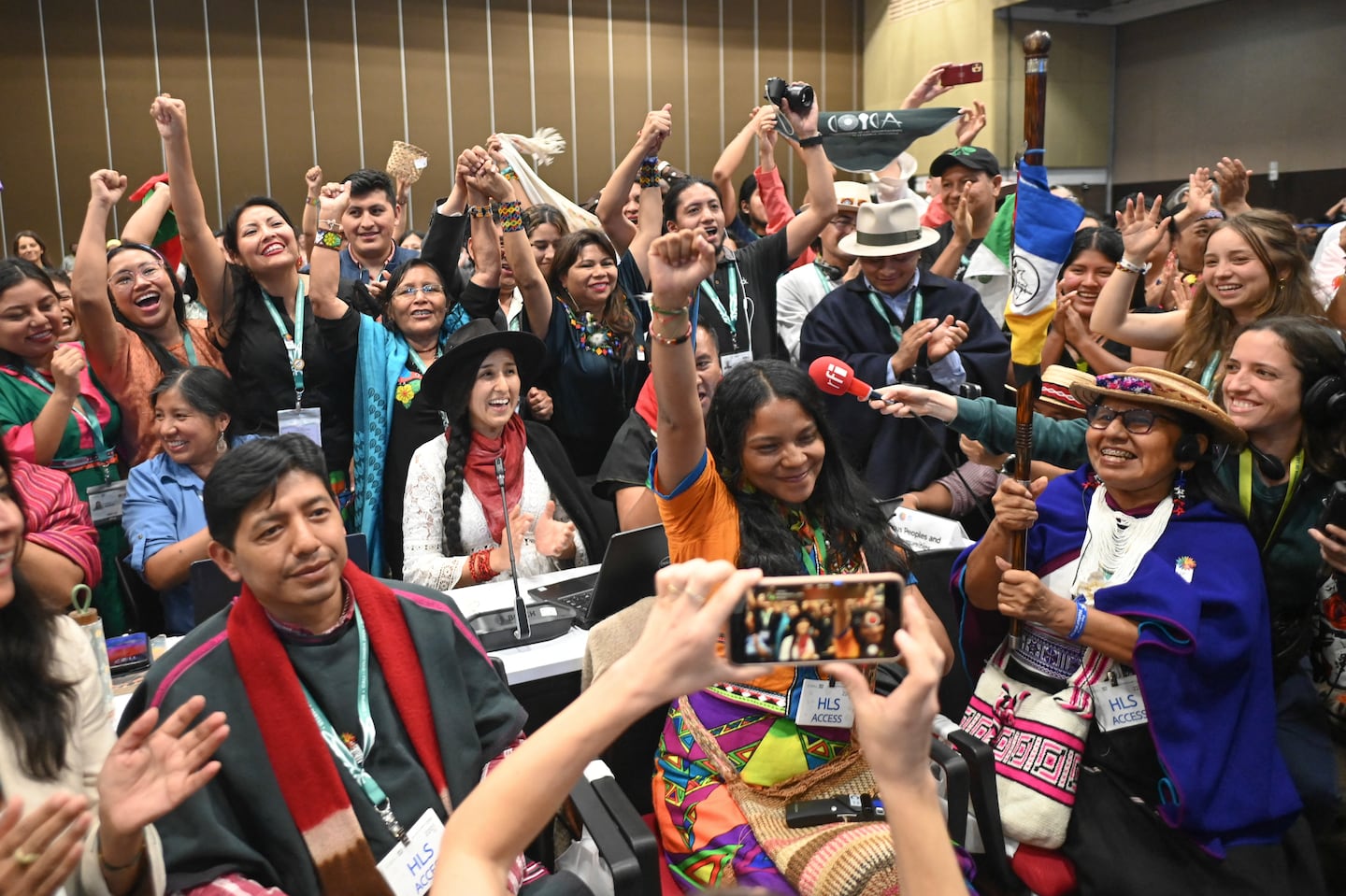 Members of indigenous communities from different countries reacted after a subsidiary body representing them in the Convention on Biological Diversity was adopted during the last plenary session of the COP16 Summit in Cali, Colombia, on Friday.