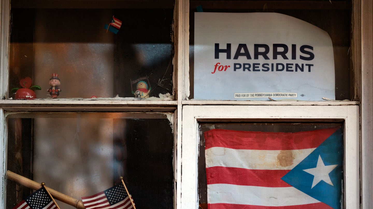 A sign in support of Vice President Kamala Harris in a window above a Puerto Rican flag in Reading, Pa., last week.