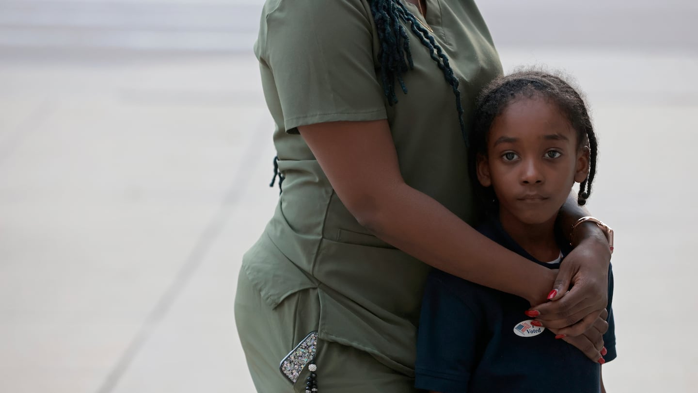 Peggy Julien in Dorchester worries about the effect of a Trump presidency on her children, including her 7-year-old son Laron. She said her parents are from Haiti.