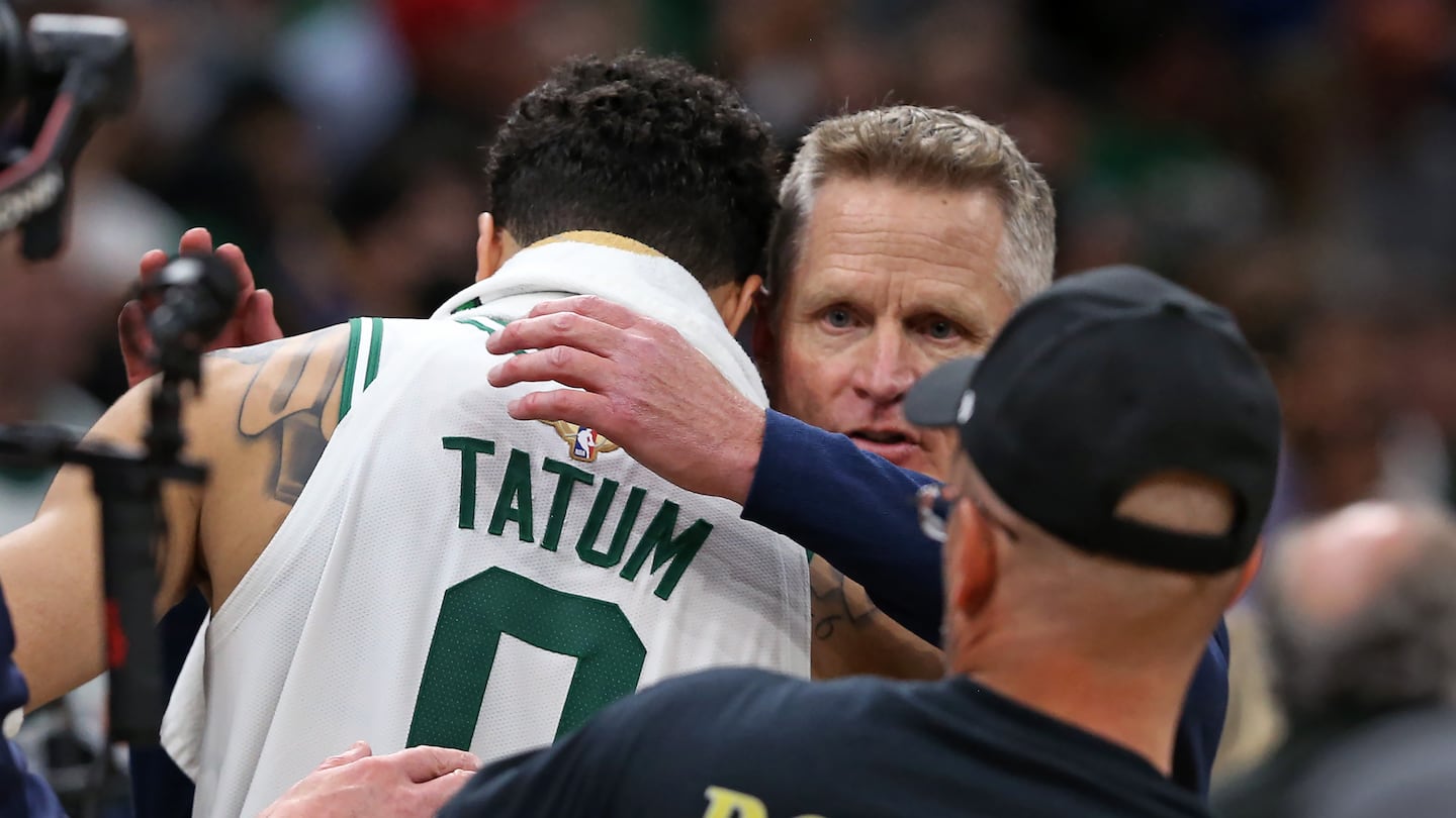 Steve Kerr greets Jayson Tatum after the Warriors won Game 6 of the 2022 NBA Finals at TD Garden.