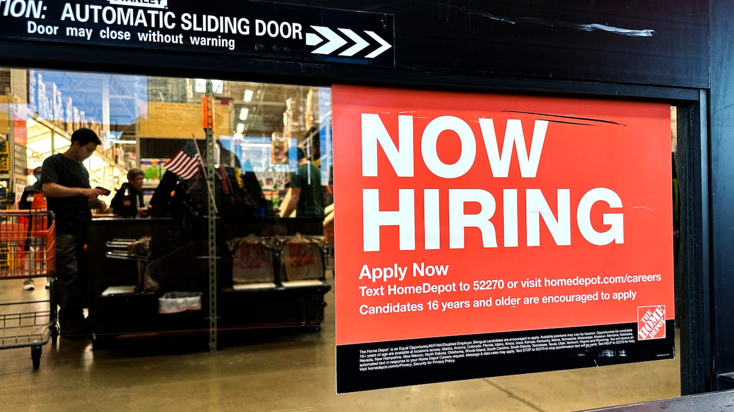 A hiring sign is displayed at a retail store in Mount Prospect, Ill., on Nov. 2.