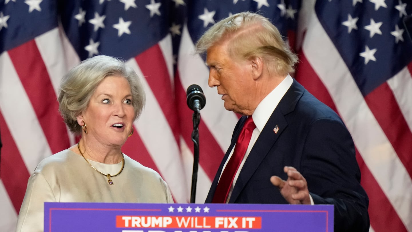 Republican presidential nominee former President Donald Trump brings Susie Wiles to the podium at an election night watch party Wednesday, Nov. 6, 2024, in West Palm Beach, Fla.