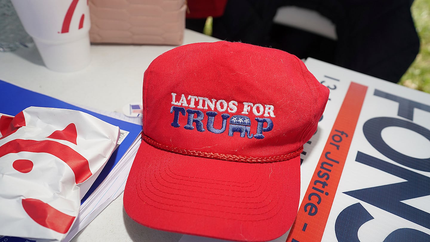 A Latinos for Trump hat rested on a table outside a polling place at Lark Community Center on March 5, 2024, in McAllen, Texas.