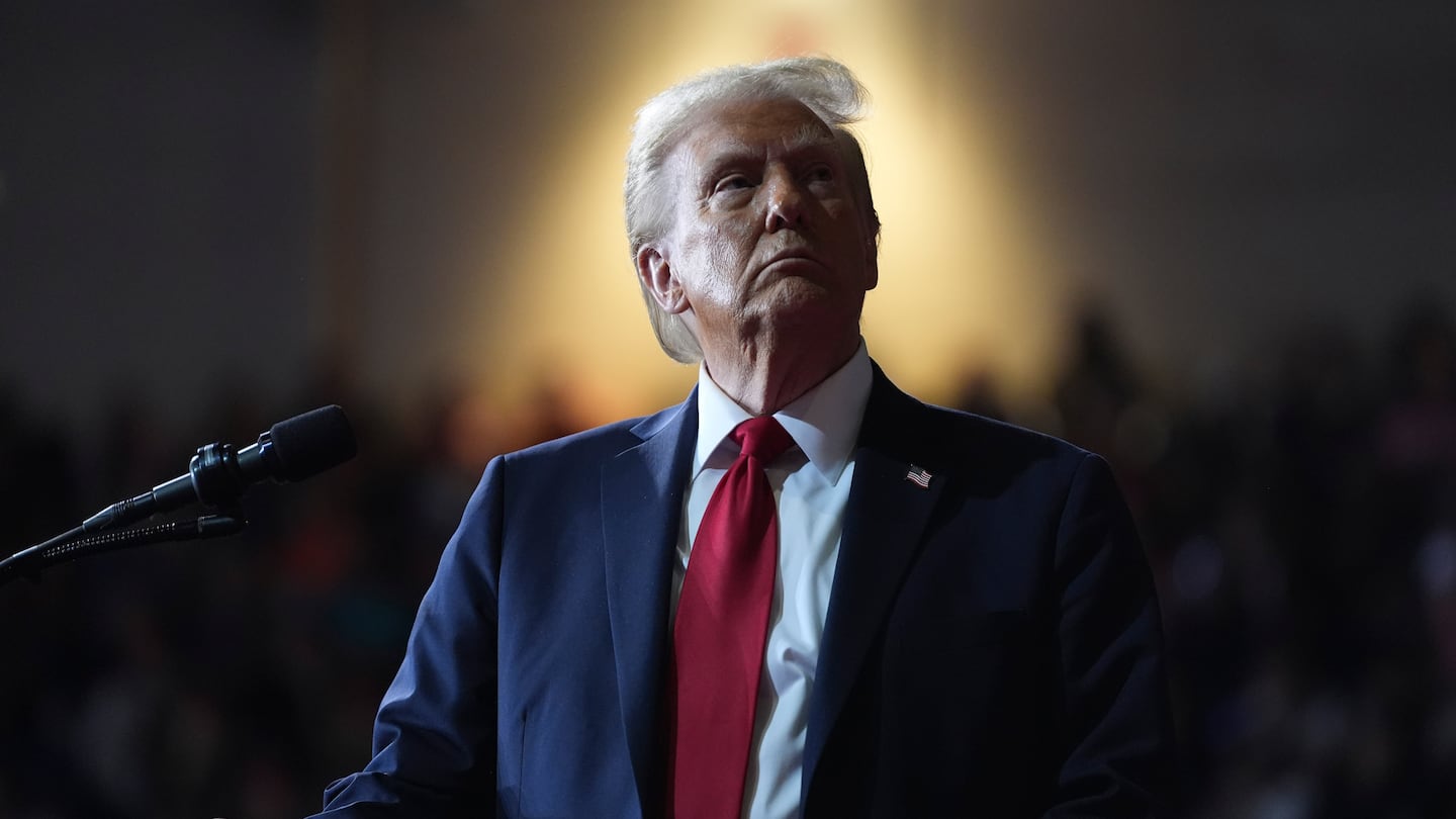 Republican presidential nominee former President Donald Trump watches a video screen at a campaign rally at the Salem Civic Center, Saturday, Nov. 2, 2024, in Salem, Va.