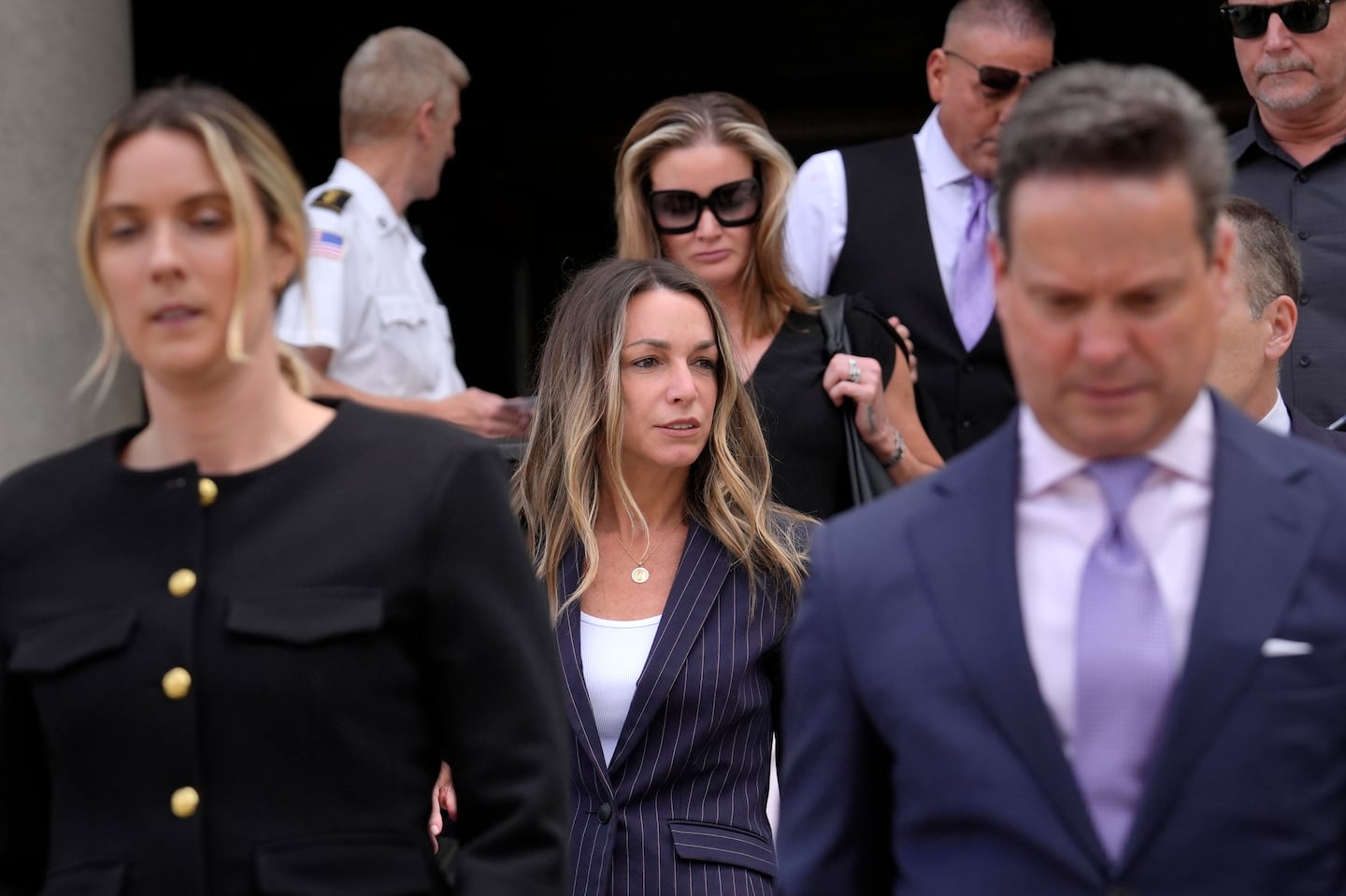 Karen Read, center, departs Norfolk Superior Court on June 26.