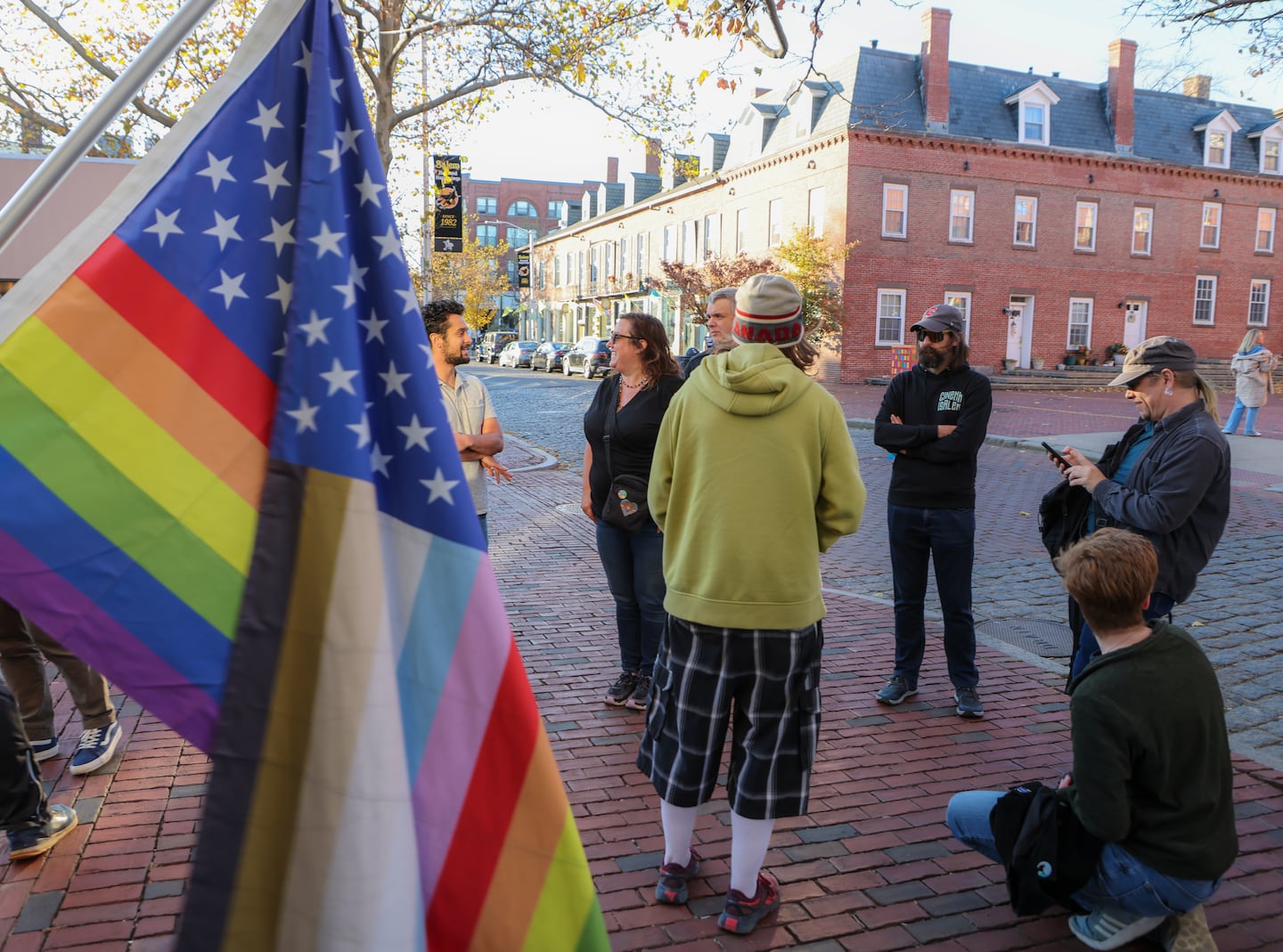 Protesters in front of Seth Moulton’s office were upset about Moulton’s comments about transgender athletes this week.