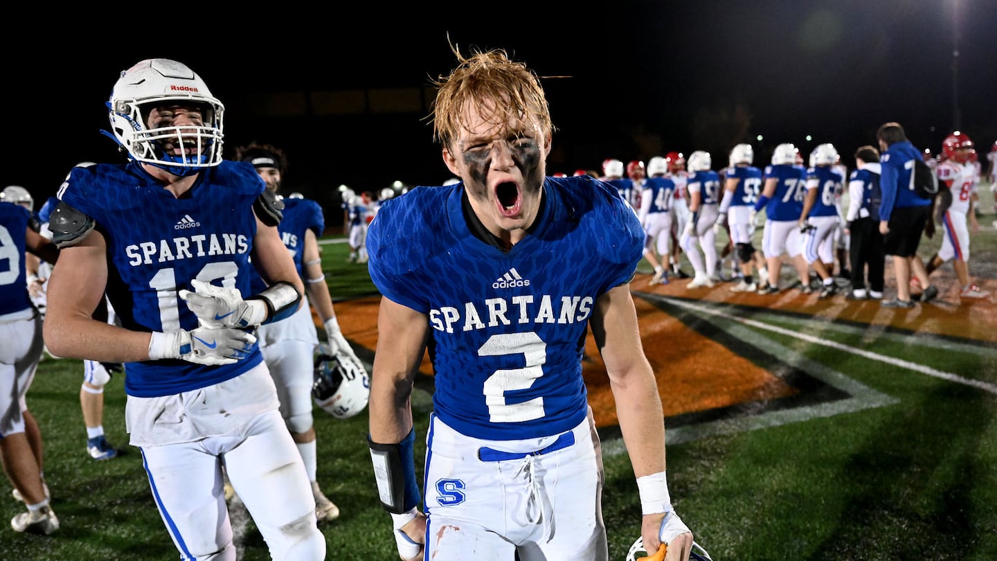 Stoneham’s Sean Kilty (center) had plenty to celebrate after leading the No. 2 Spartans to a 28-21 Division 6 first-round win over No. 15 Oakmont on Saturday.