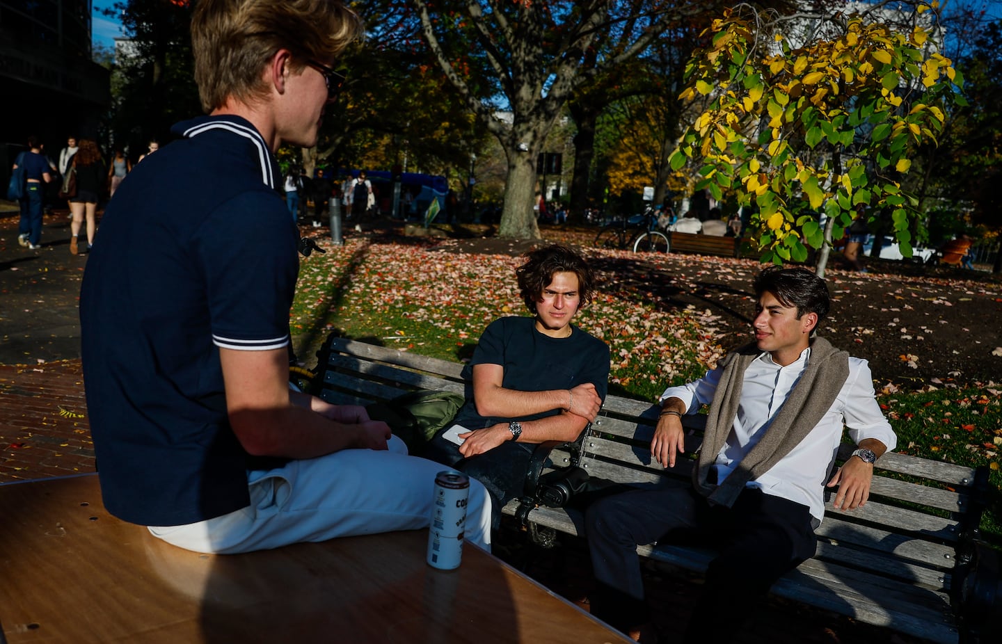 From left, Miles Rucker, Jack Dushey, and Nicolas Campos hang out between classes on Northeastern University’s campus the day after the election.