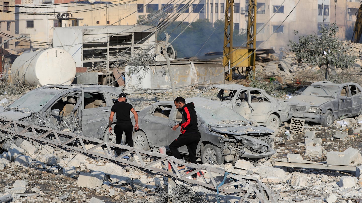 Residents checked the site of an Israeli airstrike in Tyre, southern Lebanon, on Saturday.