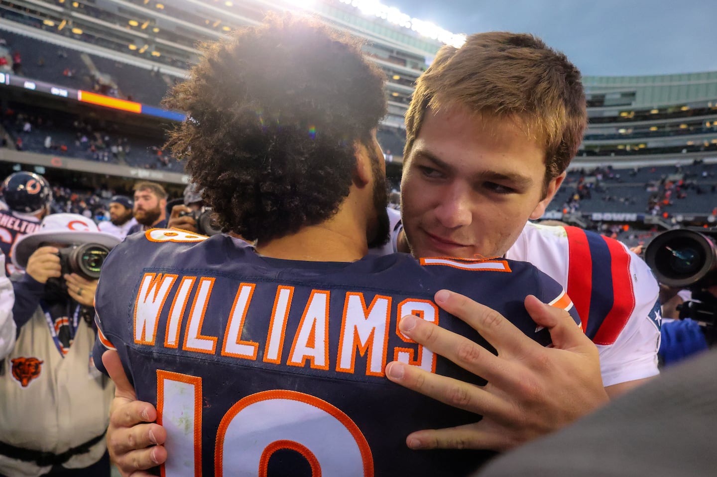 Drake Maye embraced Caleb Williams after Sunday's win over the Bears.